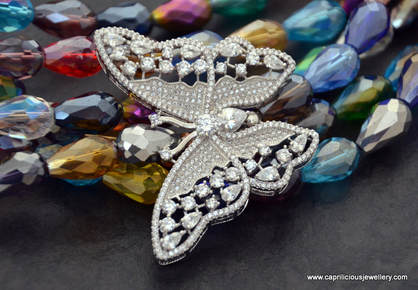 Bling, a butterfly and crystal necklace by Caprilicious Jewellery