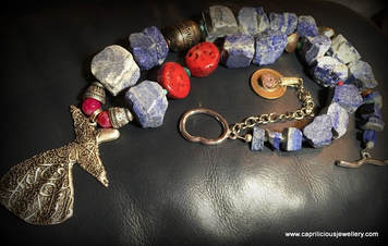 Sufi, Rumi and lapis lazuli and coral necklace by Caprilicious Jewellery