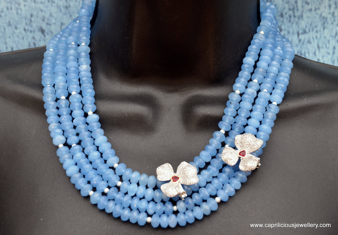 Four strands of blue chalcedony, diamante orchids, statement necklace by Caprilicious Jewellery