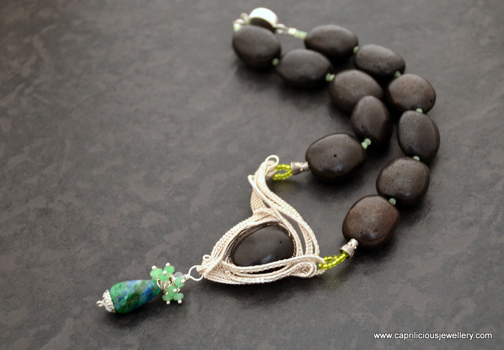 Black Beauty - a wire work pendant on a necklace of black ceramic beads by Caprilicious Jewellery