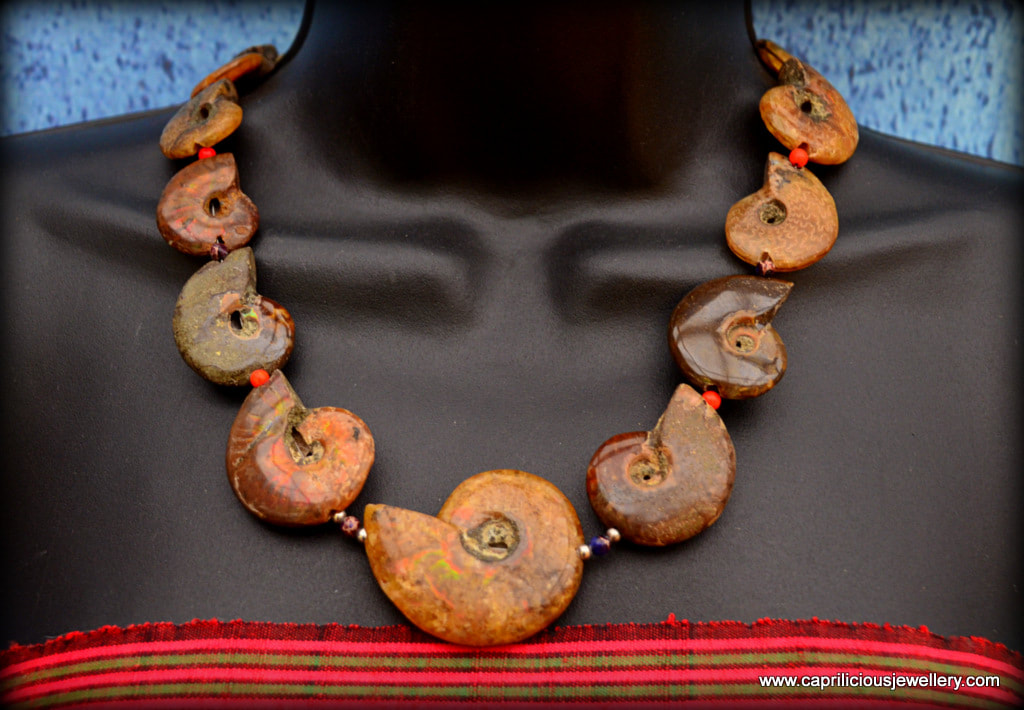 Samudra (Ocean) A string of ammonite beads with a beautiful ruby corundum clasp by Caprilicious Jewellery
