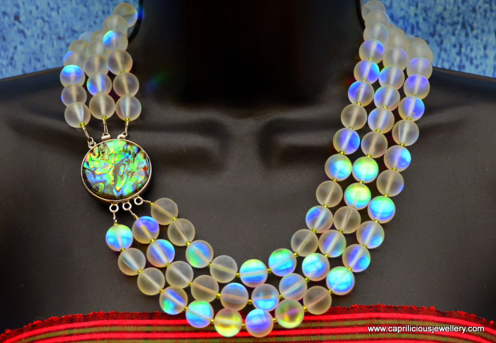 Aura - frosted glass opalite beads with an AB coating, and shell clasp by Caprilicious Jewellery