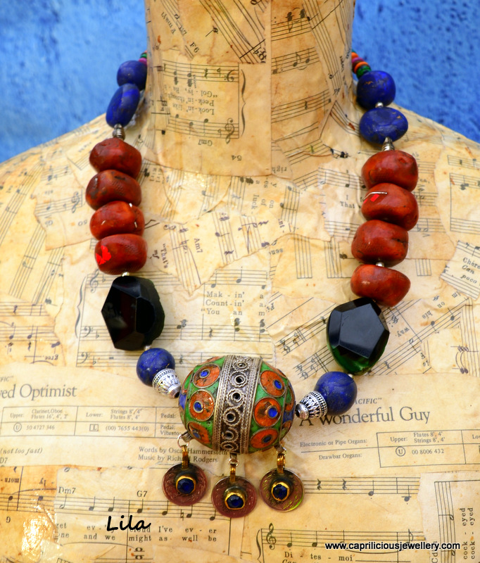 Moroccan egg pendant on a Moroccan Influenced necklace with faux amber and faux lapis beads made from polymer clay by Caprilicious Jewellery