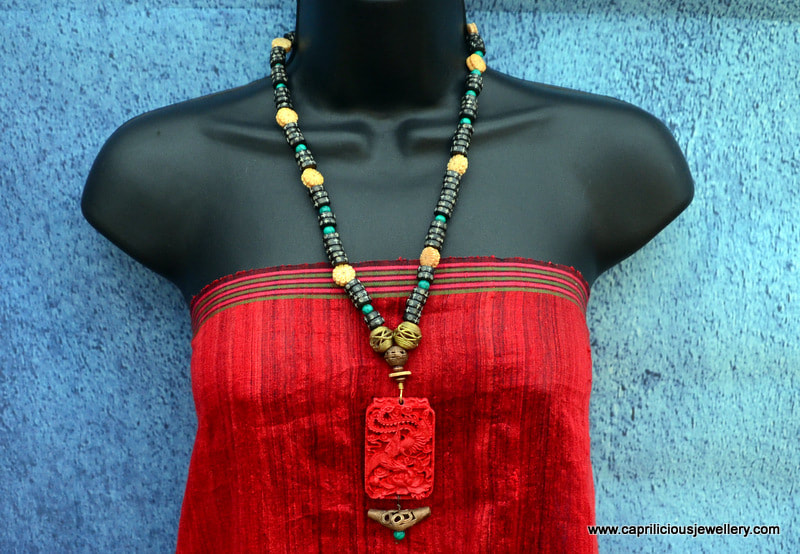 Li Chi, a cinnabar pendant with bone and turquoise beads by Caprilicious Jewellery