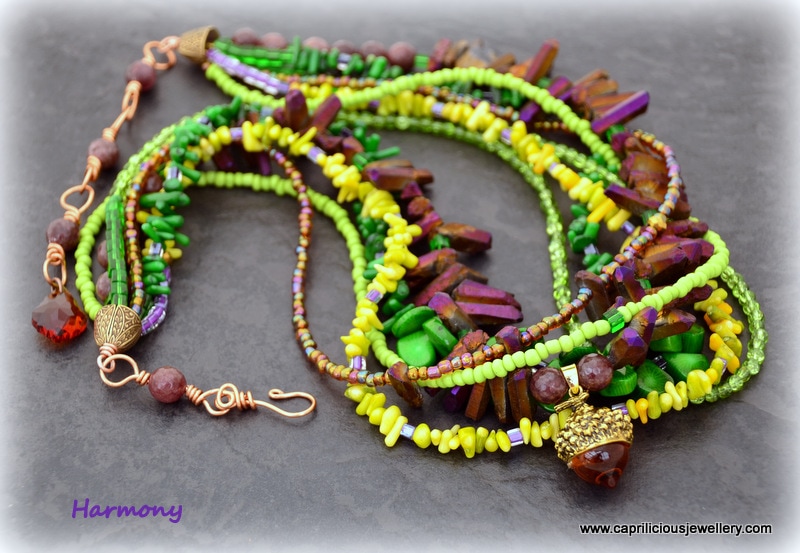 Multi strand necklace, green coral, purple titanium plated quartz needles and seed beads by Caprilicious Jewellery