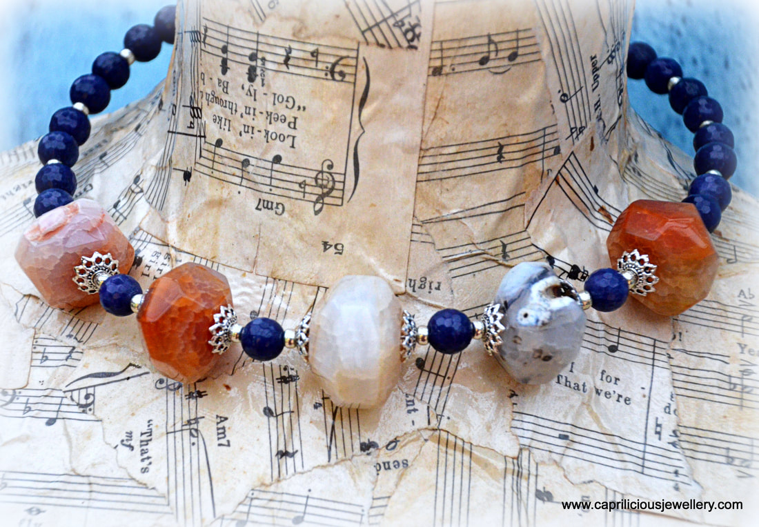 Peach banded agate and blue jade in a torque necklace by Caprilicious Jewellery