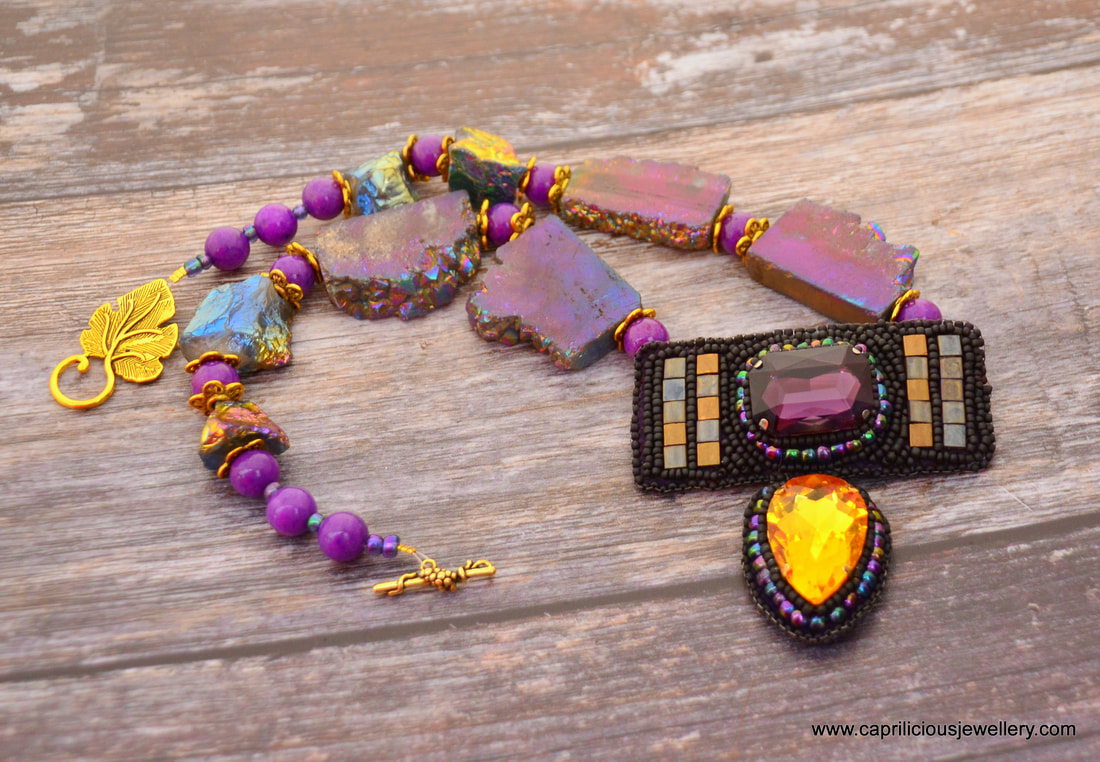 Jezebel, a statement necklace in purple crystals and titanium coated druzy by Caprilicious Jewellery