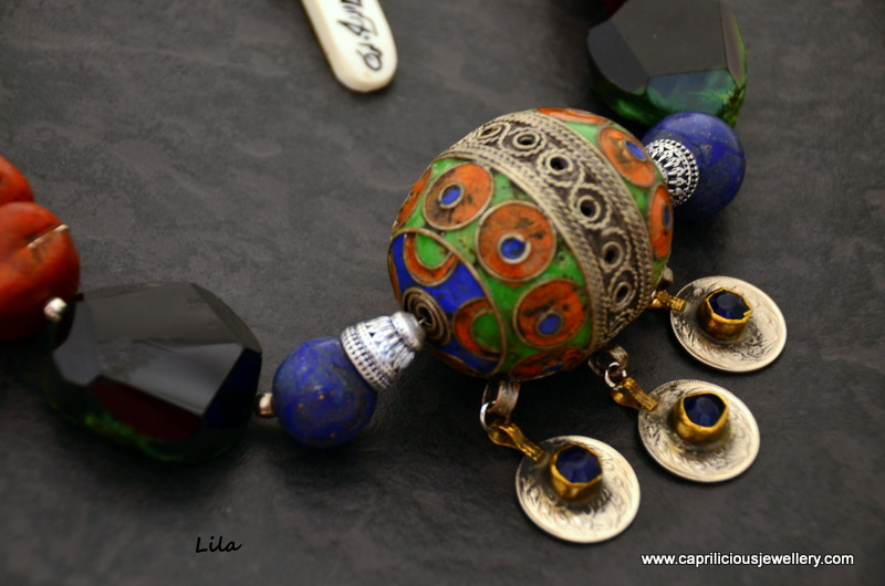 Moroccan egg pendant on a Moroccan Influenced necklace with faux amber and faux lapis beads made from polymer clay by Caprilicious Jewellery