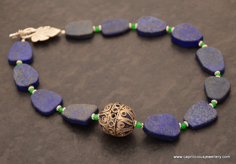 Lapis slab nugget necklace with a Moroccan enamelled bead by Caprilicious Jewellery