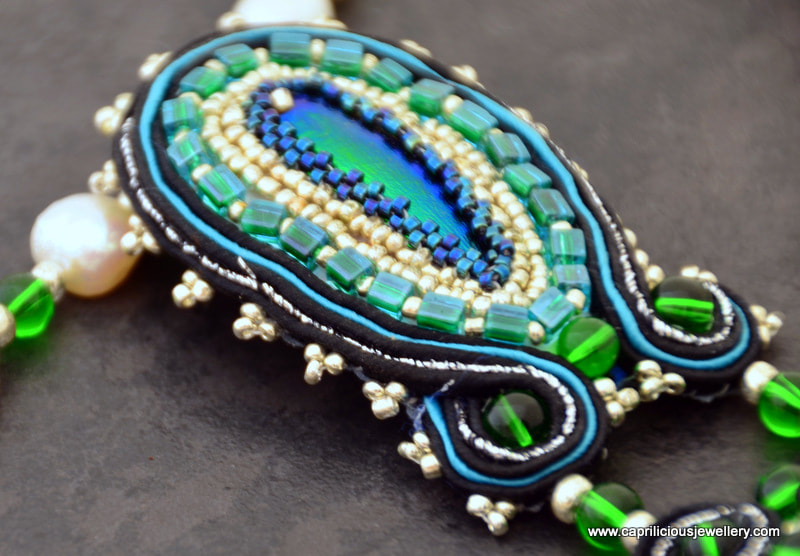 Soutache and beadwork, beetle wing jewellery, dichroic glass cabochon by Caprilicious Jewellery