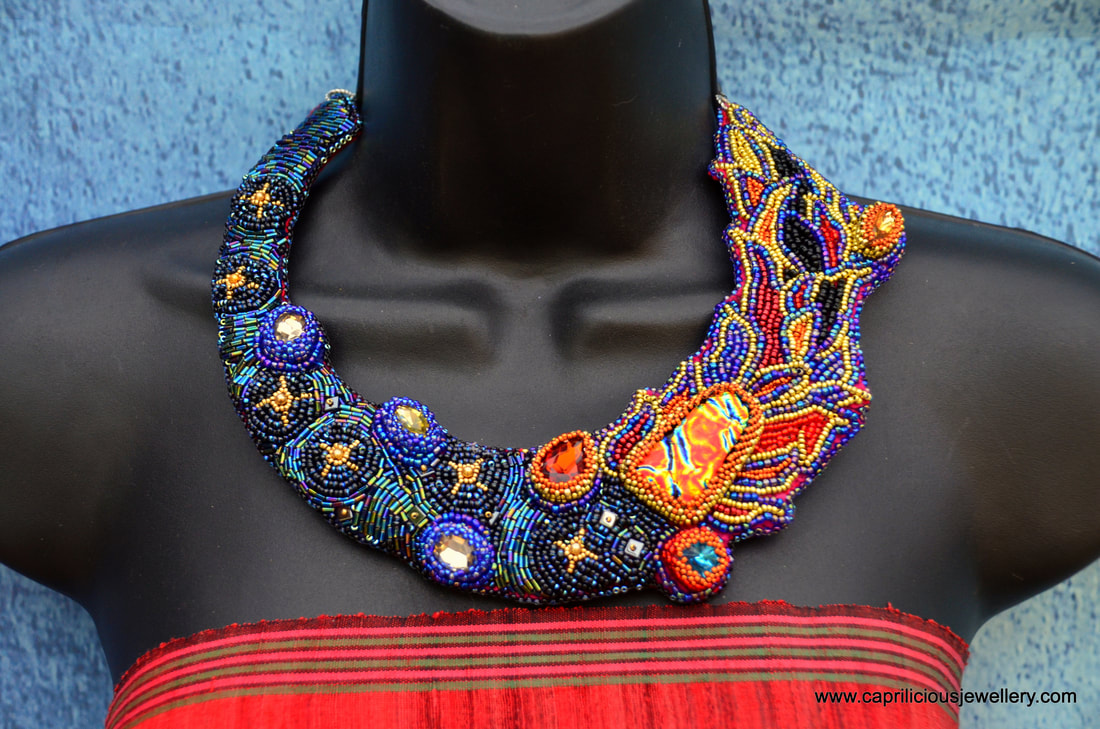 statement necklace, St Elmo's fire, night sky necklace, planet jewellery, red, gold and blue jewellery, lbd, evening necklace