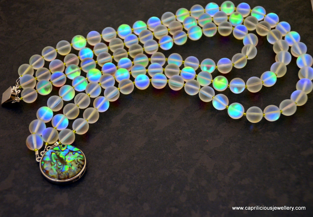 Aura - frosted glass opalite beads with an AB coating, and shell clasp by Caprilicious Jewellery