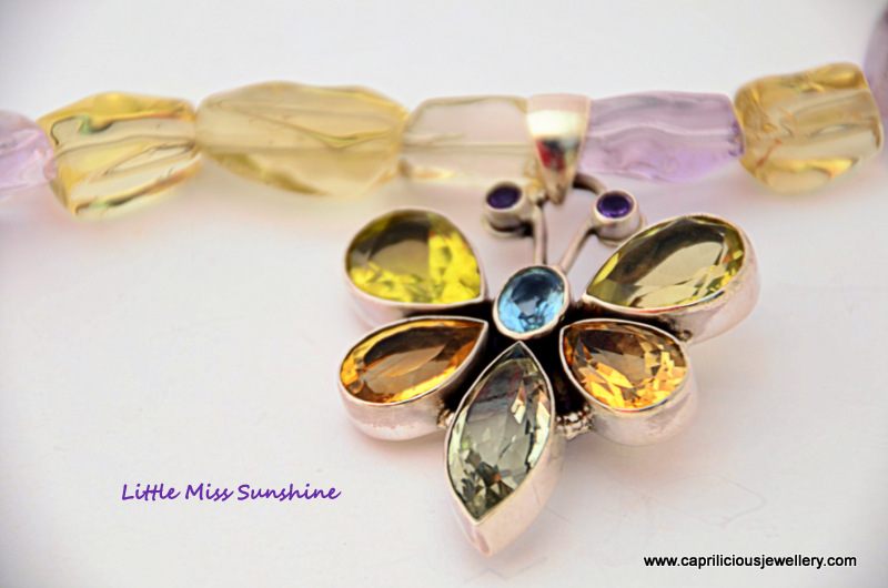 Sterling silver and semi precious gemstone butterfly pendant on an ametrine necklace with earrings to match by Caprilicious Jewellery