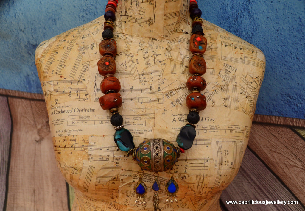 Moroccan Tagemout pendant and faux amber polymer clay beads in a Tribal statement necklace by Caprilicious Jewellery