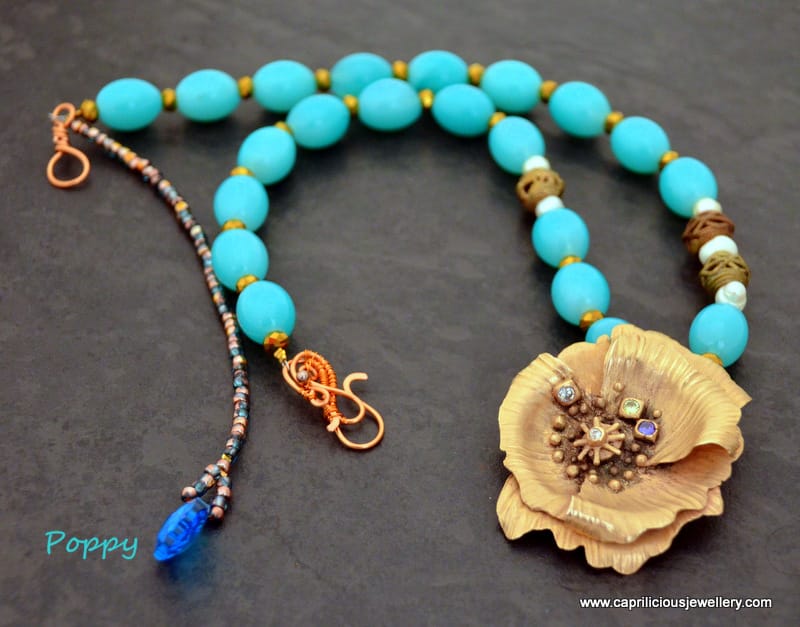 Poppy - bronze clay flower, dyed blue jade necklace, Kenyan lost wax cast beads, handmade wire clasp by Caprilicious Jewellery