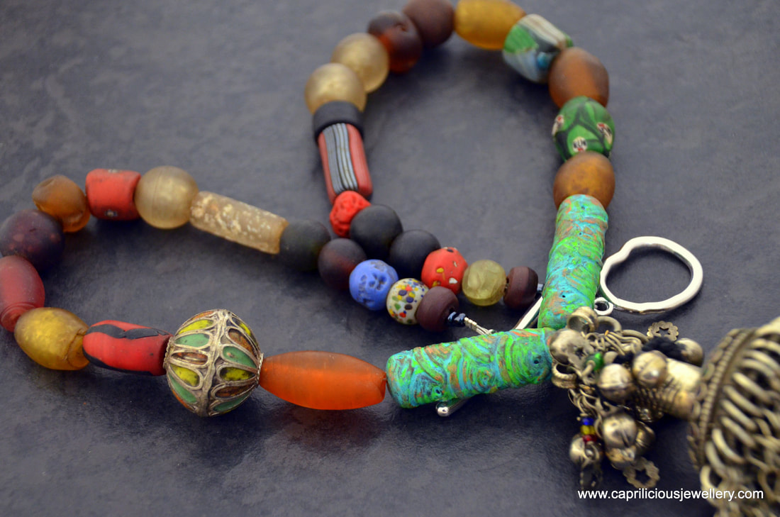 Afghani pendant, and Krobo glass necklace by Caprilicious Jewellery