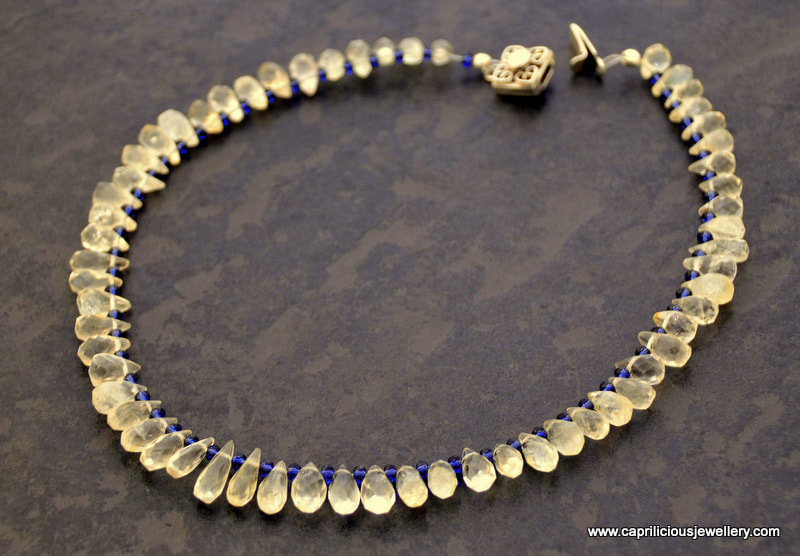 Citrine teardrops and iolite beads with a silver box clasp by Caprilicious Jewellery
