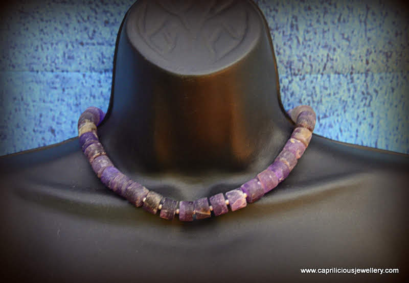 Matte amethyst cylinders in a necklace with a diamante clasp by Caprilicious Jewellery