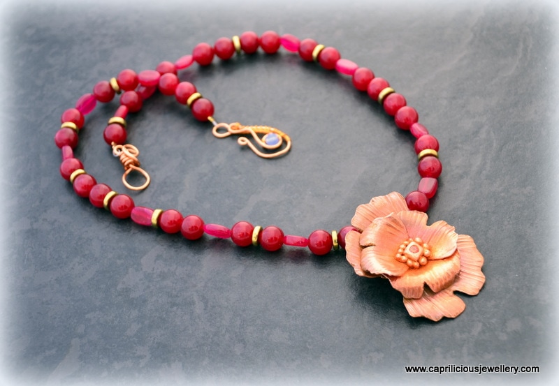 Copper clay flower on a red jade necklace, handmade wire clasp by Caprilicious Jewellery