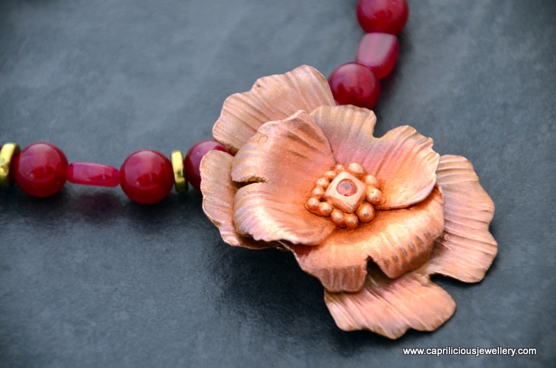 Copper clay flower on a red jade necklace, handmade wire clasp by Caprilicious Jewellery