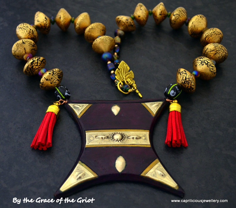 Tcherot Tuareg amulet on a necklace of gold foil polymer clay beads by Caprilicious Jewellery