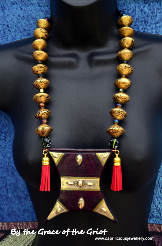 Tcherot Tuareg amulet on a necklace of gold foil polymer clay beads by Caprilicious Jewellery