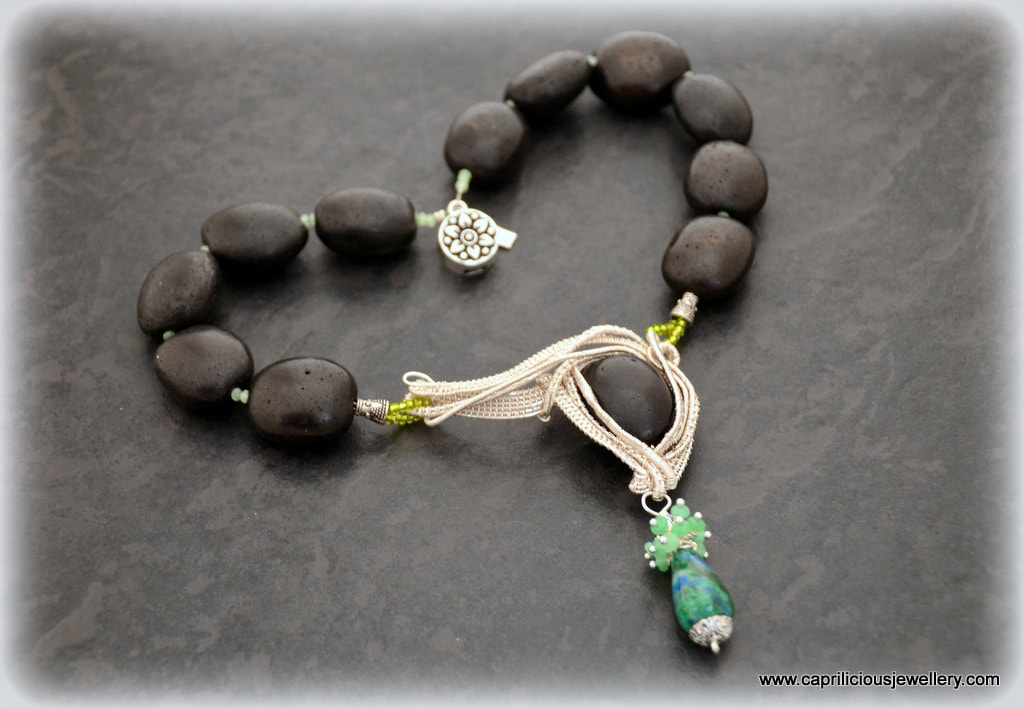 Black Beauty - a wire work pendant on a necklace of black ceramic beads by Caprilicious Jewellery