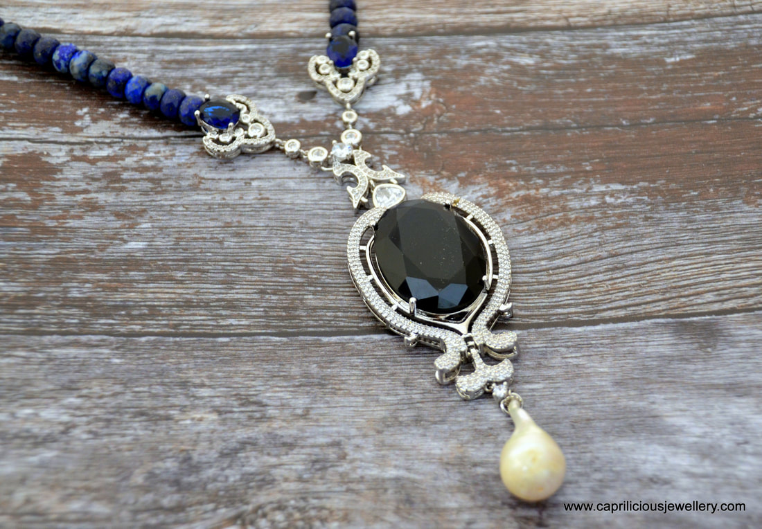 Lapis lazuli necklace with a micro pave pendant and connectors