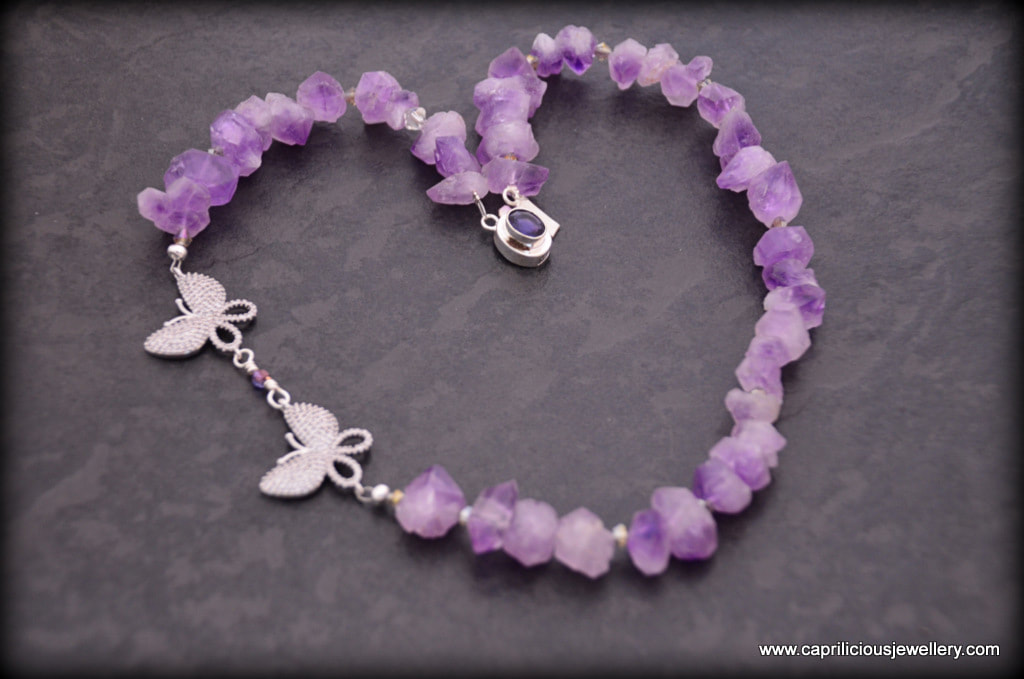 Frou Frou, an amethyst nugget necklace with micro pave diamante butterflies by Caprilicious Jewellery