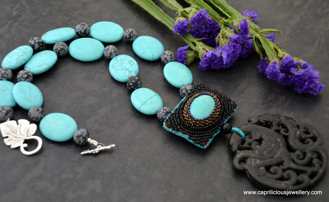 A beadwork turquoise and jade pendant with a turquoise and chrysanthemum stone necklace by Caprilicious Jewellery