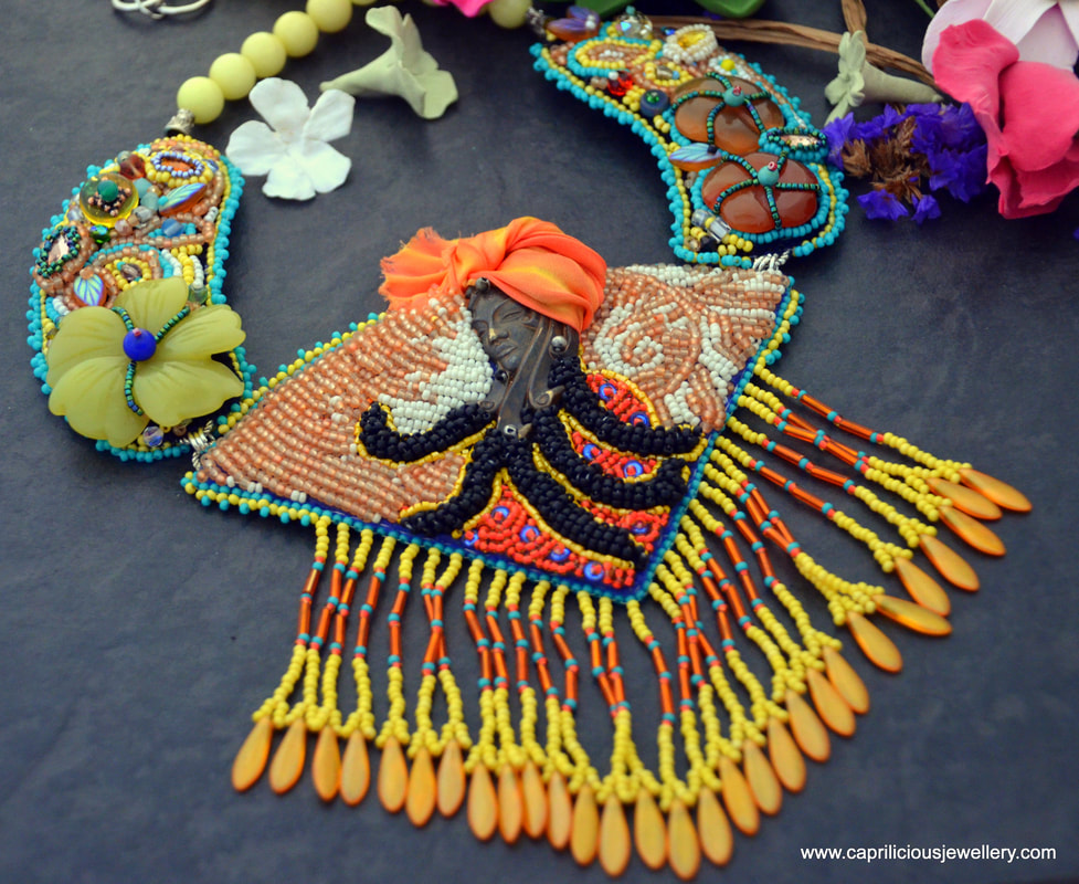 Calypso, painting with beads, Kinga Nichols, enchanted garden jewellery, Afro Caribbean jewellery,colourful necklace, statement jewellery, Vintaj, shibori silk, turban
