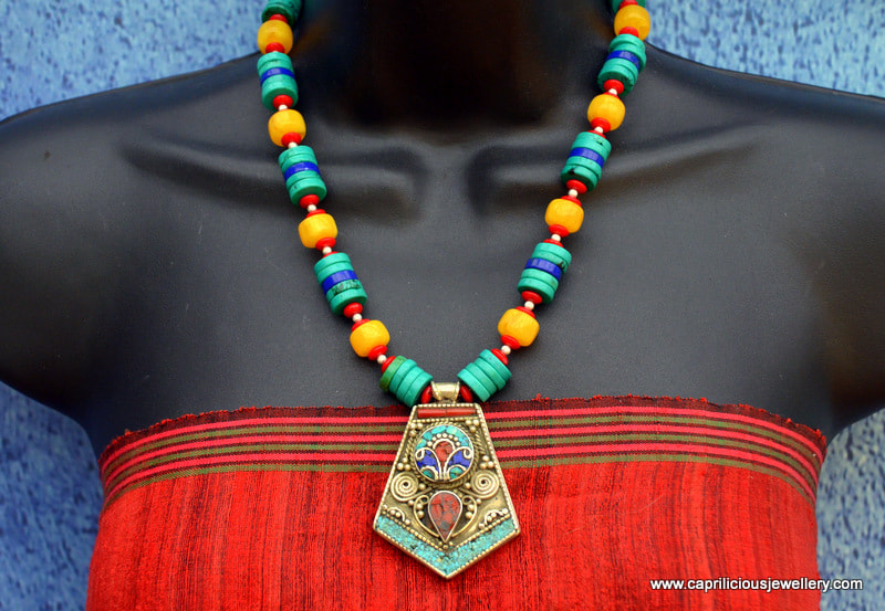 Nepalese pendant on a necklace of turquoise, coral, lapis and faux amber by Caprilicious Jewellery