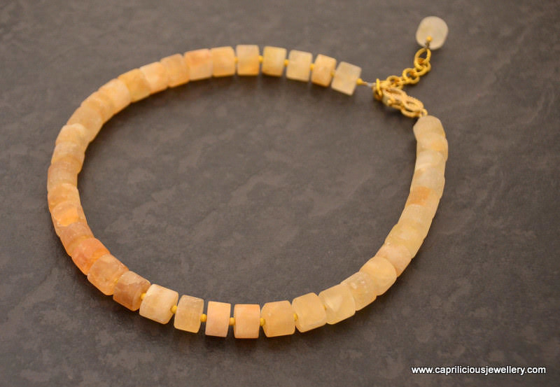 Matte citrine cylinders in a necklace with a diamante clasp by Caprilicious Jewellery