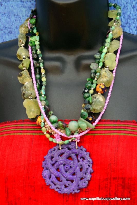 multistrand necklace, prehnite rough cut nuggets, ruby with zoisite and turquoise and a hand carved dyed jade pendant by Caprilicious Jewellery