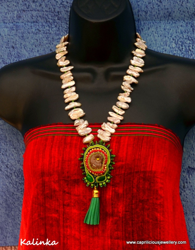 Ammonite fossil pendant, soutache braiding and seed beads ultrasuede tassel on a necklace of Biwa pearls