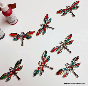 Dragonfly components coloured using cold enamels and hotfix crystals by Caprilicious Jewellery