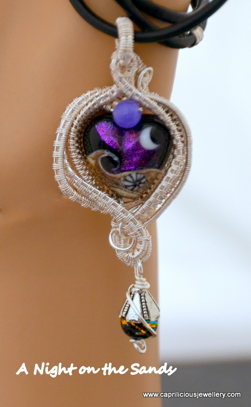 A Night on the Sands - lampwork glass pendant set in wire by Caprilicious Jewellery