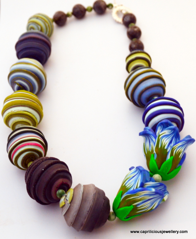 Polymer clay beads and flower necklace by Caprilicious Jewellery