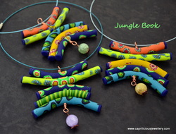 Polymer clay totem pendants by Caprilicious Jewellery