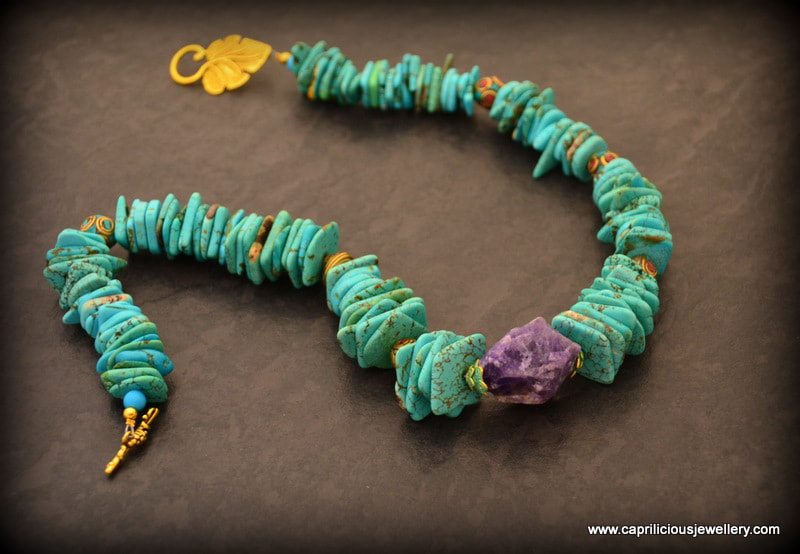 Turquoise dyed magnesite and raw amethyst in a colourful necklace by Caprilicious Jewellery