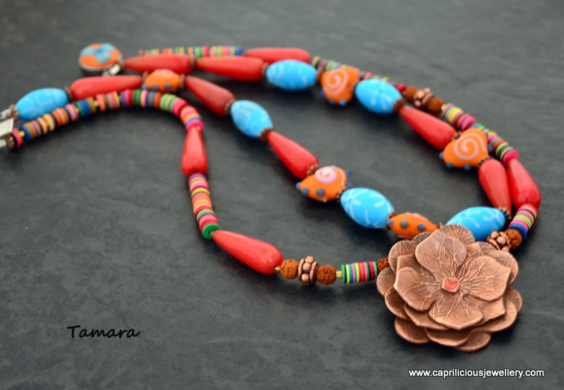 Tamara - Copper clay lotus pendant, ceramic beads, African vinyl beads, Milagro heart beads necklace, hand made polymer clay inlaid clasp by Caprilicious Jewellery