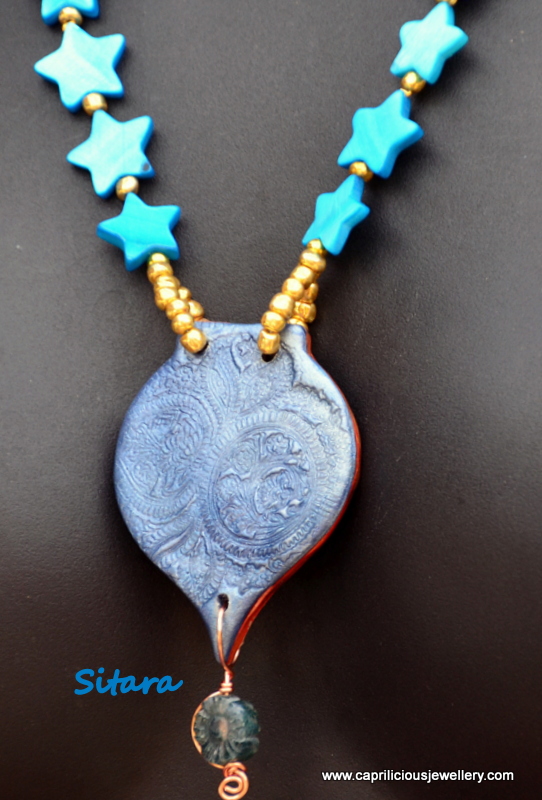 Sitara - Hand made polymer clay pendant and shell bead necklace by Caprilicious Jewellery