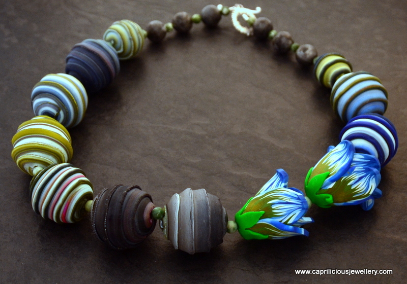 Polymer clay beads and flower necklace by Caprilicious Jewellery