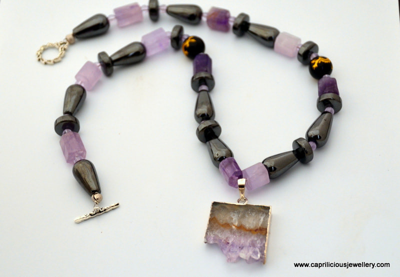 Amethyst druzy pendant on a haematite and amethyst necklace, purple and black, by Caprilicious Jewellery