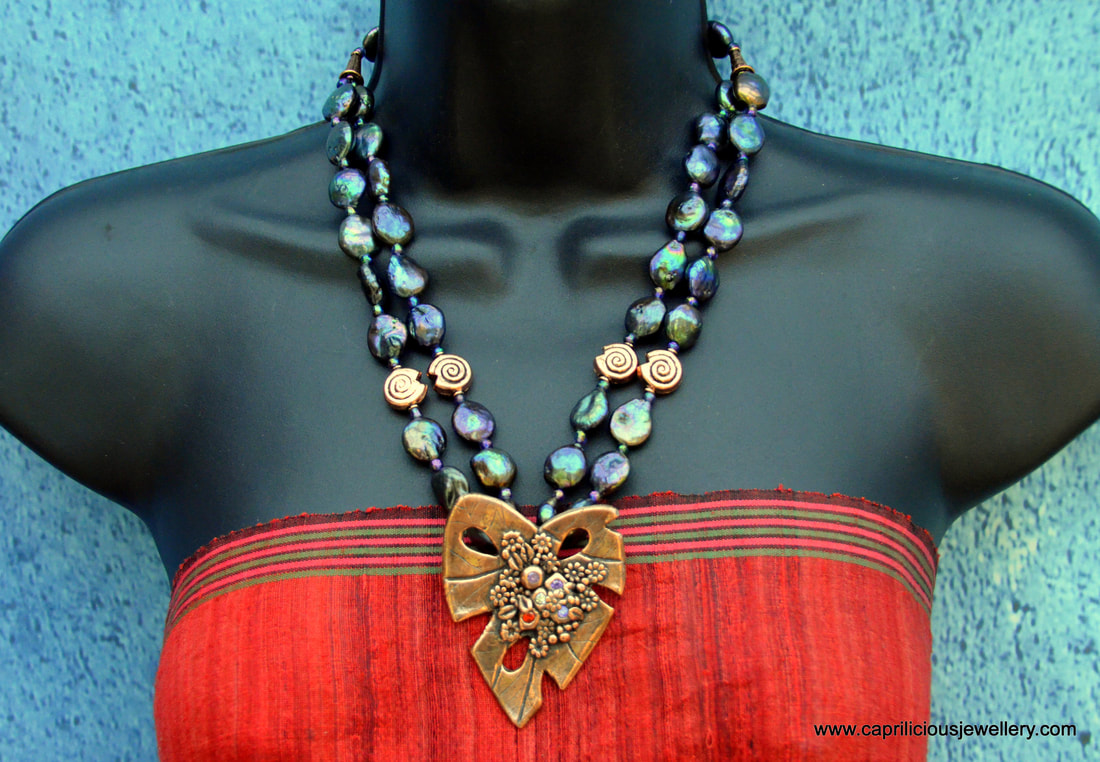 The Last Leaf - a copper clay leaf and rainbow dyed coin pearls in a statement necklace by Caprilicious Jewellery
