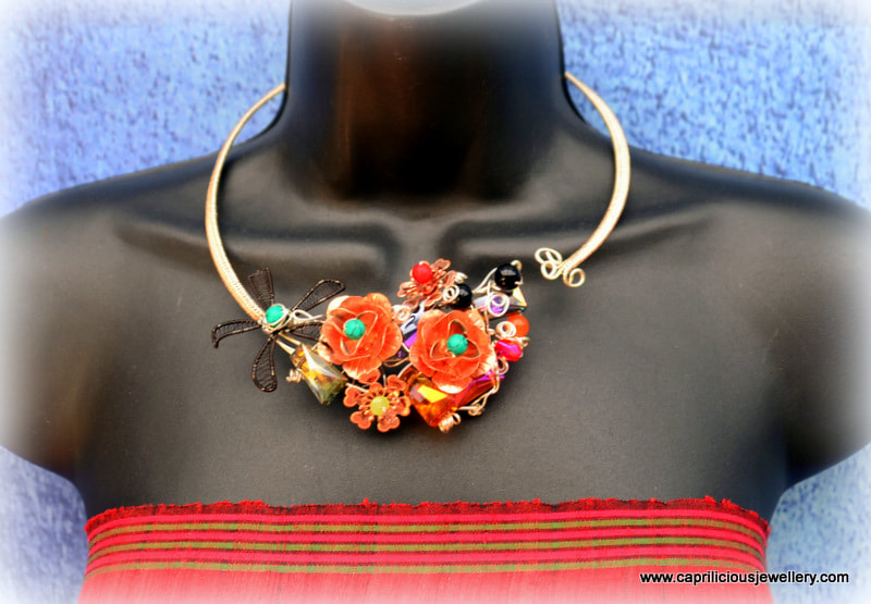 Floral torque necklace, statement necklace by Caprilicious Jewellery