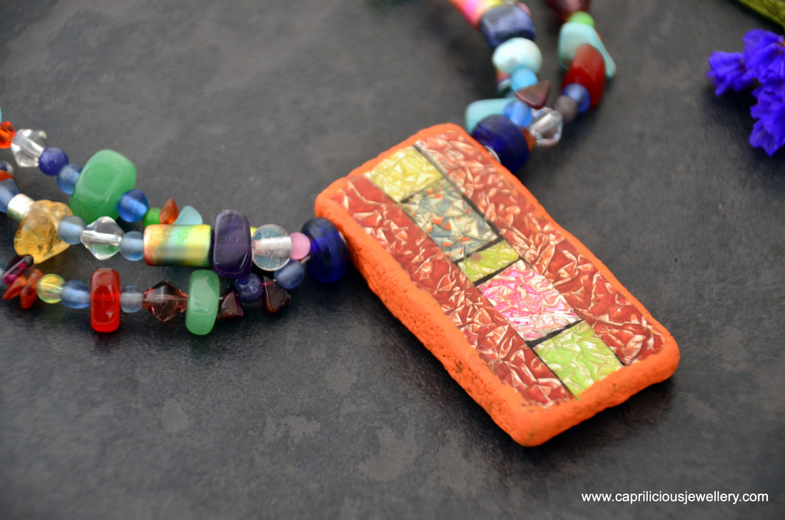Bead Soup necklace with polymer clay and resin pendant by Caprilicious Jewellery