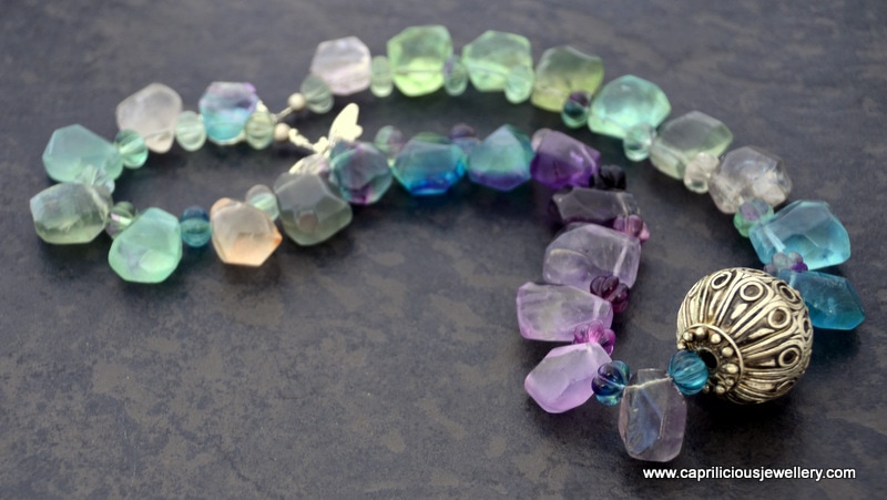 Fluorite teardrop beads and Moroccan focal bead in a colourful necklace by Caprilicious Jewellery