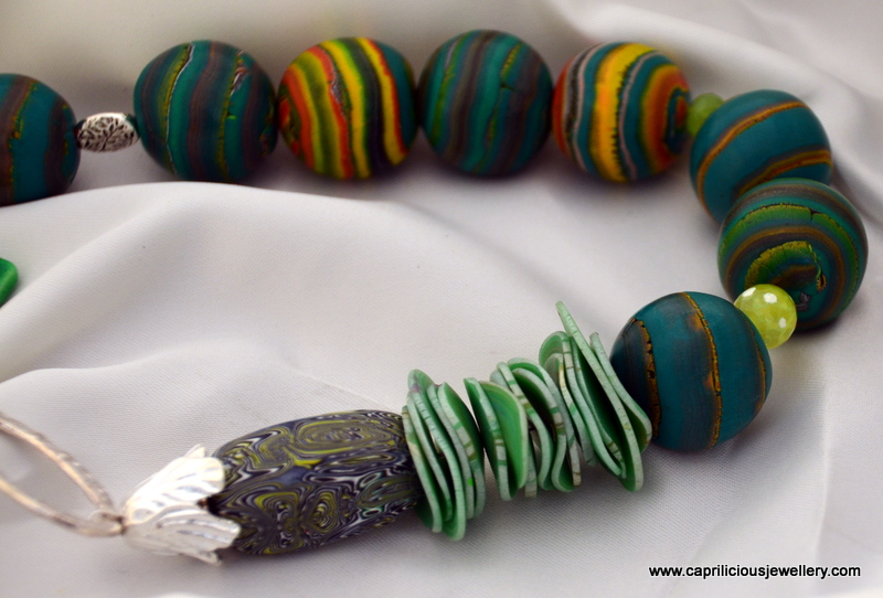 Polymer clay bead necklace - Rings of Saturn by Caprilicious Jewellery