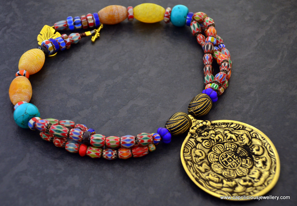 Feng Shui necklace, with a Bagua talisman on a necklace of chevron beads by Caprilicious Jewellery